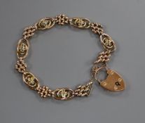 An Edwardian 9ct and seed pearl set fancy link bracelet (pearls missing), gross 12 grams.