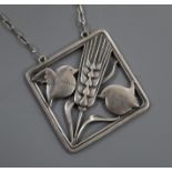 A Georg Jensen sterling 'wheatsheaf flanked by robins' square pendant, no. 93, on a fine link chain,