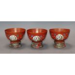 A set of three Chinese coral ground bowls, Republic period Provenance - The owner and her family