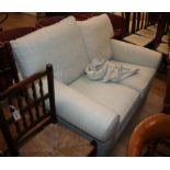 A modern pale cream upholstered two seater settee W.145cm approx.
