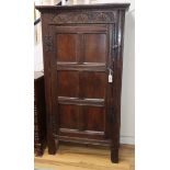 A 17th century carved oak cupboard (altered) H.164cm