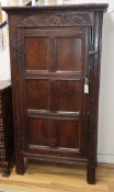 A 17th century carved oak cupboard (altered) H.164cm