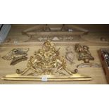 A 19th century carved giltwood door pediment, another giltwood carving of a lion rampant and an