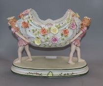 A Continental floral encrusted porcelain centrepiece height 26cm