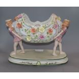 A Continental floral encrusted porcelain centrepiece height 26cm