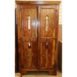 An Eastern olive wood two door hanging wardrobe H.200cm