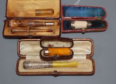 A collection of amber cigar and cigarette holders