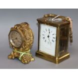 A carriage clock and a gilt timepiece