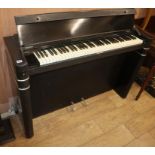 An Art Deco style ebonised Eavestaff mini piano W.130cm