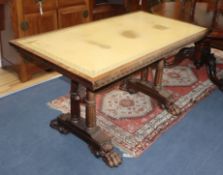 A mid-19th century carved rosewood library table, having green skiver and raised on turned double
