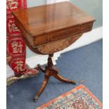 A Regency inlaid rosewood work table on tripod base W.51cm