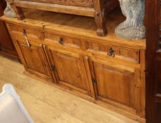 An olive wood dresser, fitted three drawers over panelled cupboards, W.168cm