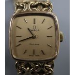 A lady's 1970's 9ct gold Omega manual wind wrist watch, on a 9ct gold Omega bracelet, with Omega box