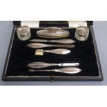 A cased 1930's eight piece (ex ten) silver mounted manicure set.