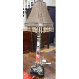 A gilt and silvered metal table lamp with mirrored triangular column
