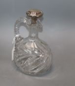 A cut glass decanter jug with sterling mounted stopper, 23.5cm.