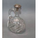 A cut glass decanter jug with sterling mounted stopper, 23.5cm.