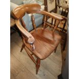 A Victorian elm and beech smokers bow chair