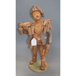 A signed terracotta figure, 'The strawberry seller', indistinctly signed height 43cm