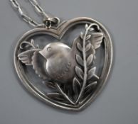 A Georg Jensen sterling 'robin and wheatsheaf' heart shaped pendant, no. 97, on fine link chain,