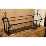 A black painted wrought iron pan rack, L.90cm