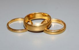 Three assorted 22ct. gold wedding rings, 12.6 grams.