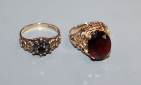 A 9ct and oval garnet set ring and one other 9ct gem set ring.