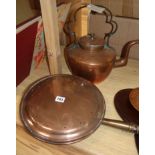 A copper kettle and a warming pan