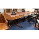 A George III style mahogany twin pillar dining table 208cm extended (one spare leaf)