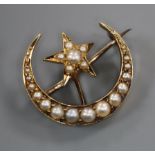 An Edwardian yellow metal and split pearl set crescent and star brooch, 20mm.