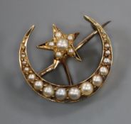 An Edwardian yellow metal and split pearl set crescent and star brooch, 20mm.