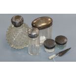 A silver-mounted scent bottle, four other toilet jars and a trowel book mark.