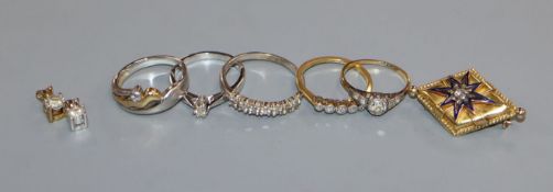 Three 18ct gold and diamond rings, a 9ct gold ring, a platinum, yellow metal and diamond ring, two