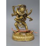 A Tibetan gilt bronze group of Mahakala, height 26cm