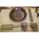 A wooden bowl, two carved wooden panels and two primitive carvings (5)