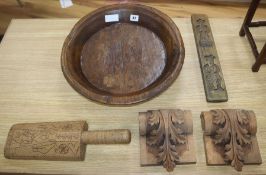 A wooden bowl, two carved wooden panels and two primitive carvings (5)