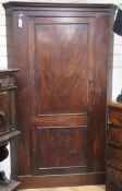 A George III mahogany standing corner cabinet H.194cm