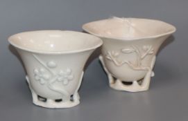 Two 17th / 18th century Chinese blanc de chine 'prunus' libation cups