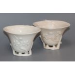 Two 17th / 18th century Chinese blanc de chine 'prunus' libation cups