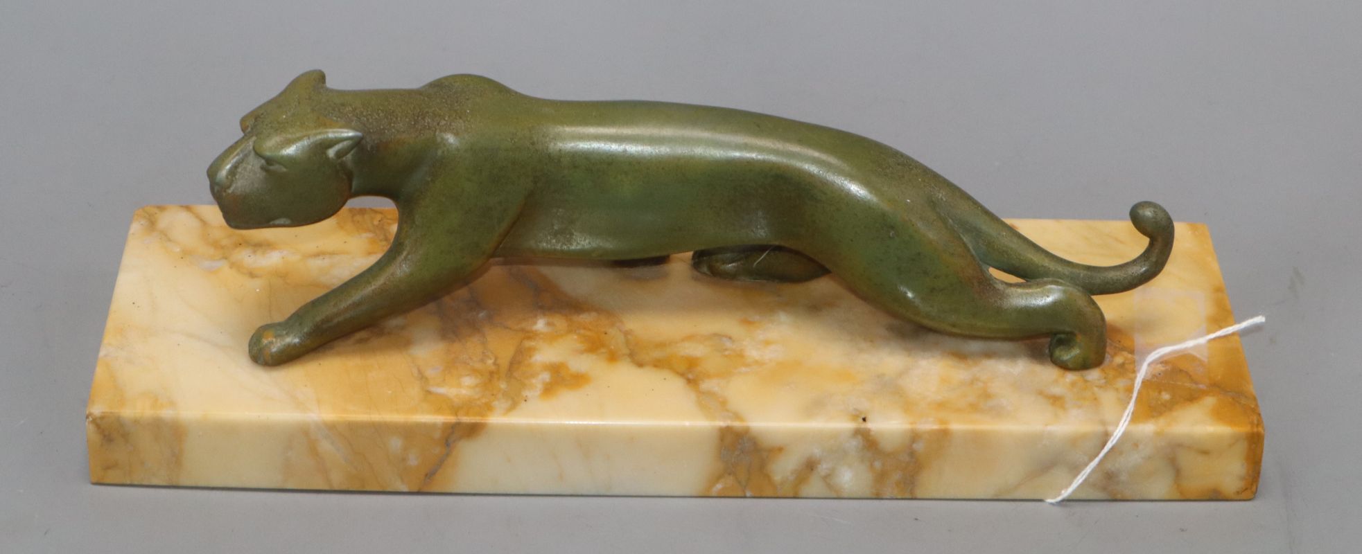 An Art Deco spelter model of a Panther, on a marble base length 30cm