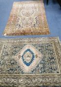 A Persian cream ground rug and one other largest 224 x 138cm