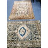 A Persian cream ground rug and one other largest 224 x 138cm