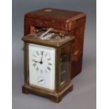 A cased brass carriage clock