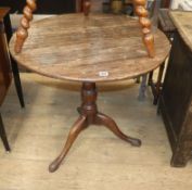 A George III oak tilt top tea table Diam.70cm