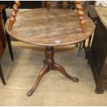 A George III oak tilt top tea table Diam.70cm