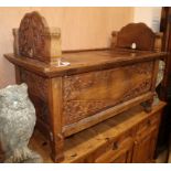 A small Eastern carved hardwood bed with slatted top, L.115cm