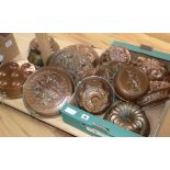A quantity of copper jelly moulds