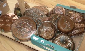 A quantity of copper jelly moulds