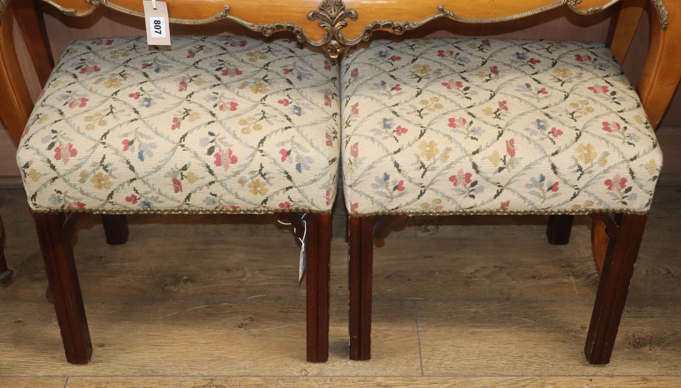 A pair of Georgian style mahogany stools