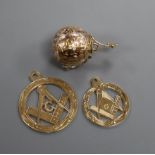 A 9ct and white metal masonic ball pendant and two 9ct gold masonic pendants.